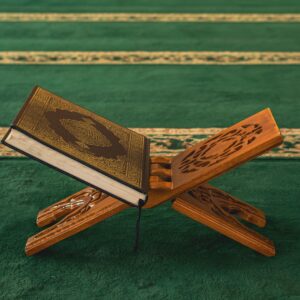 Qur'an on a wooden stand in a mosque, symbolizing Islamic faith and spirituality.
